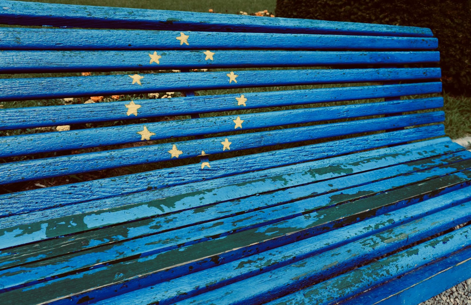 a blue bench with stars painted on it